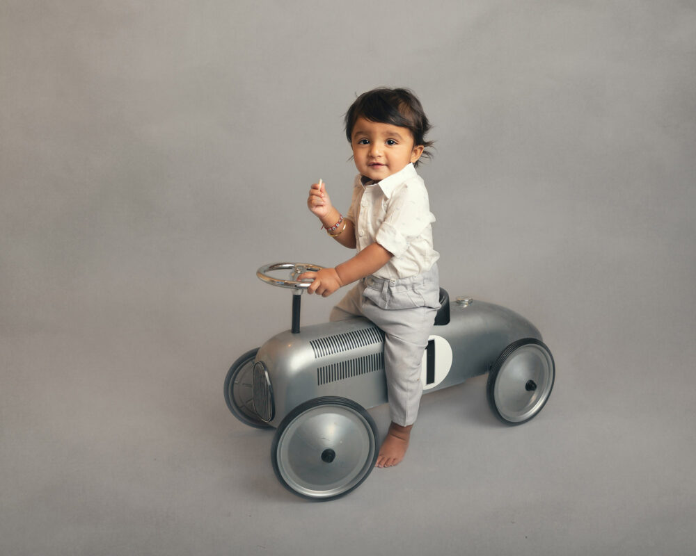 little-boy-on-vintaqge-bike-by-surrey-baby-photographer